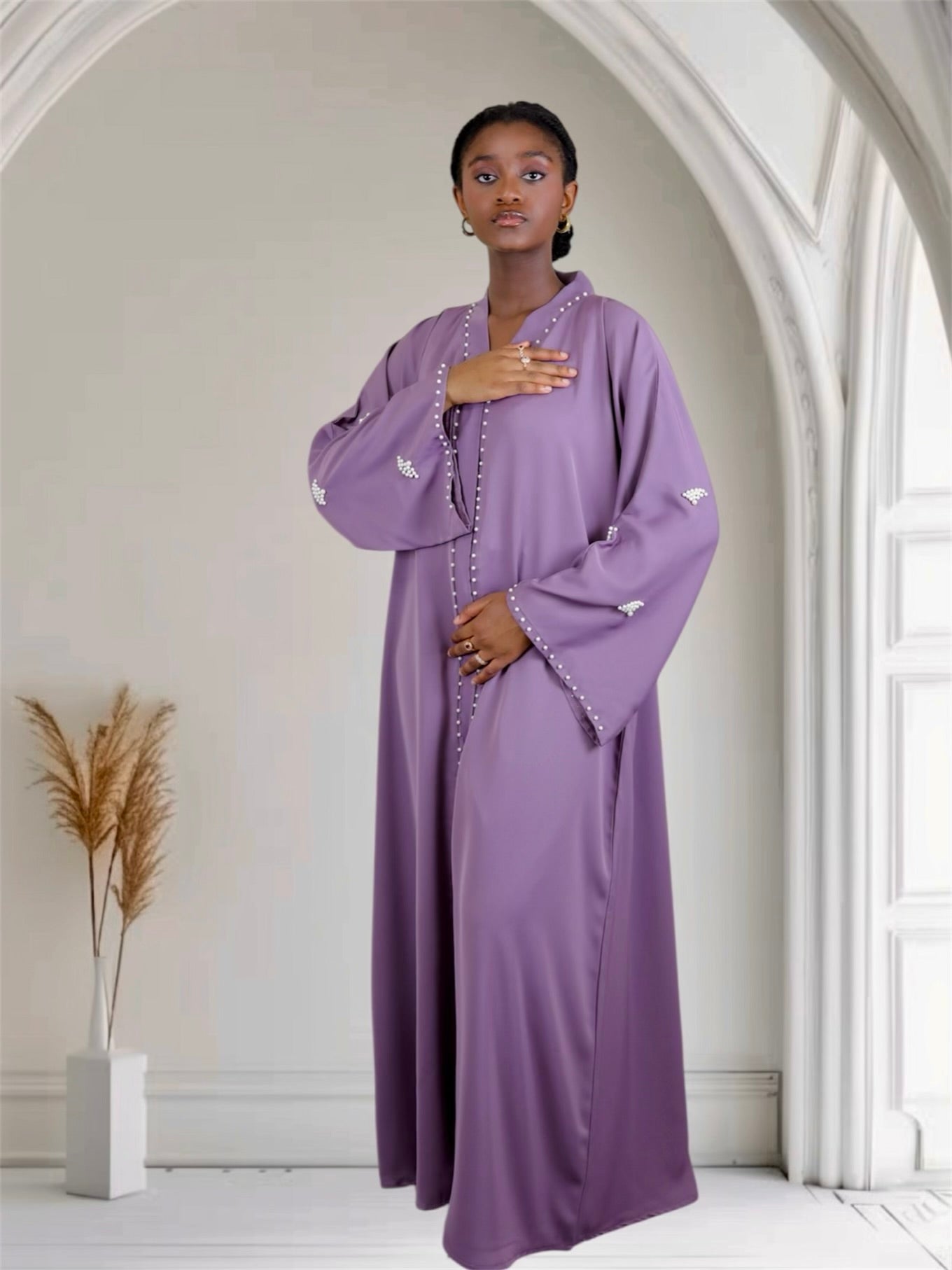 Woman purple abaya dress with white embellishments