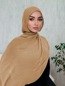 Woman wearing a beige premium modal hijab — soft breathable everyday hijab from Ayesha's Collection USA