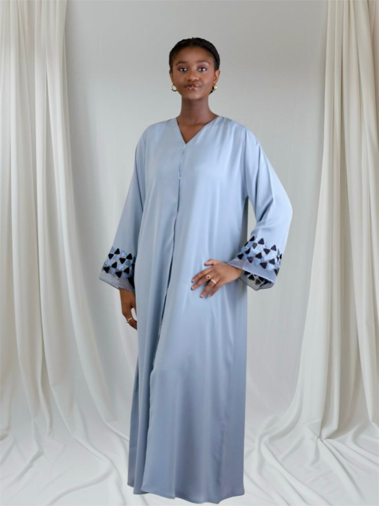 Woman in a slate blue luxury embroidered abaya set — elegant occasion wear by Ayesha's Collection