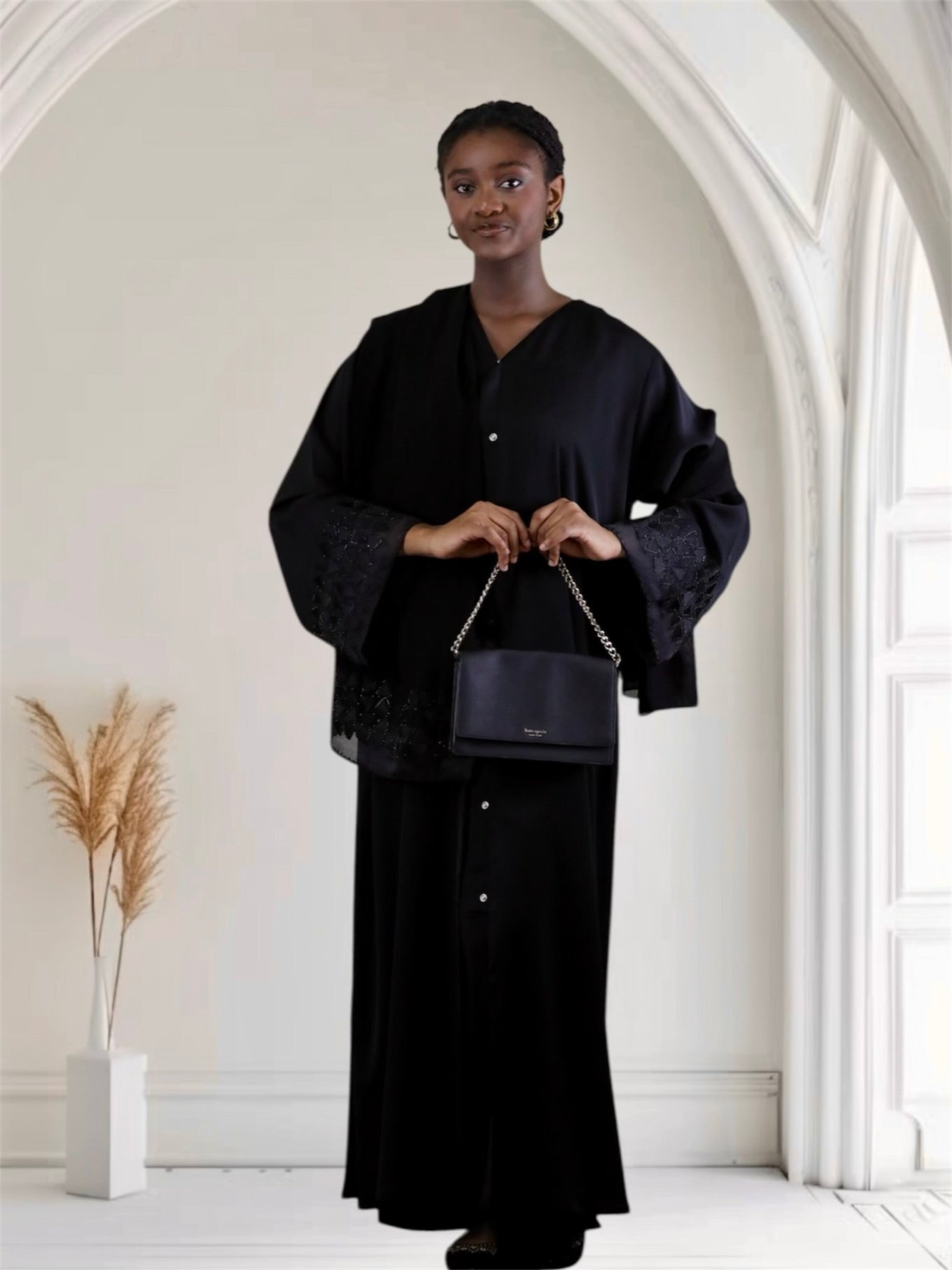 women wearing a black outfit with matching scarf