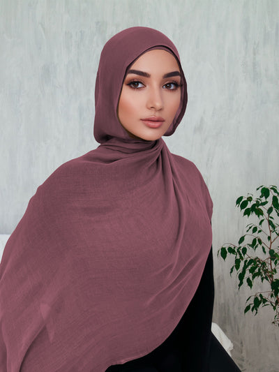 Woman wearing a mauve premium breathable modal hijab — modest fashion for women USA