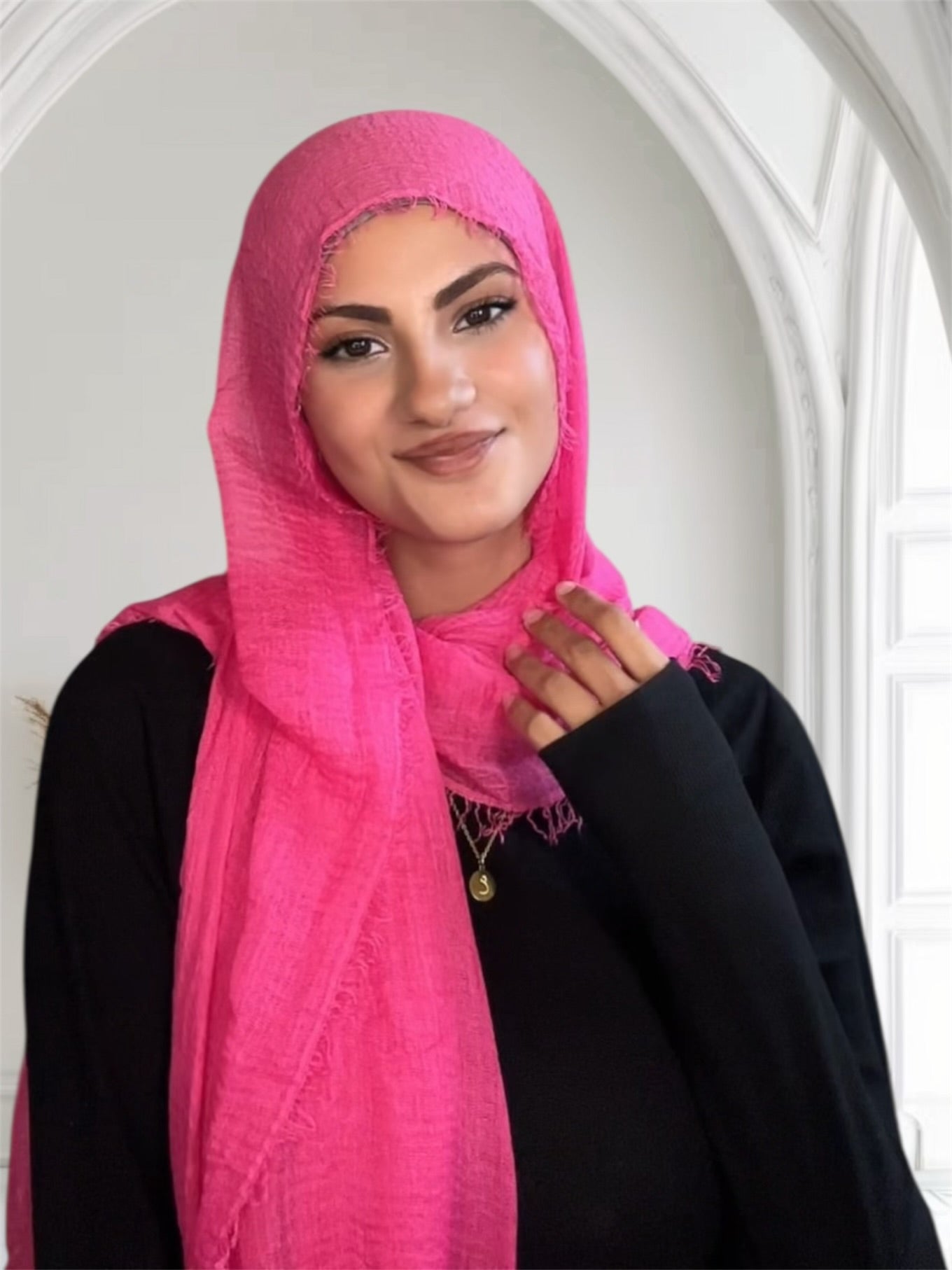 Woman wearing a bright pink hijab in USA