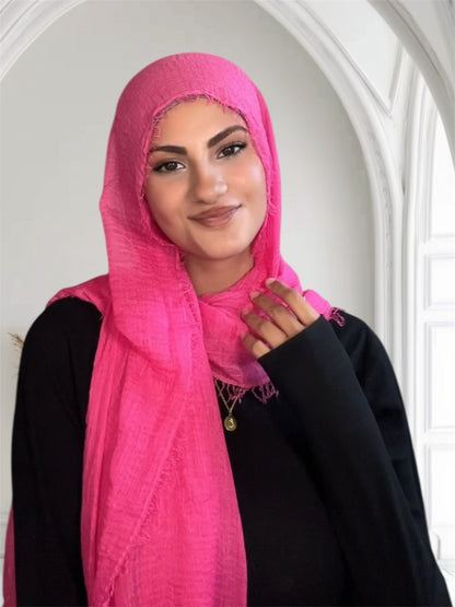 Woman wearing a bright pink hijab in USA