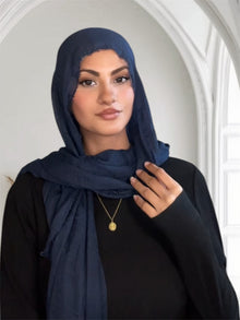 Woman wearing a navy hijab