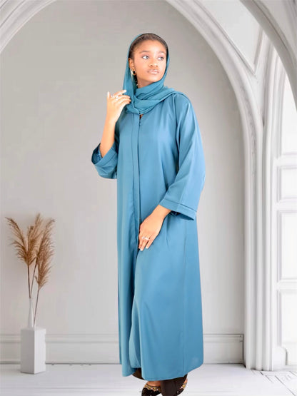 Woman long blue abaya dress with scarf. 