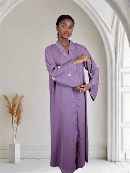 Woman deep mauve abaya dress with white pearls