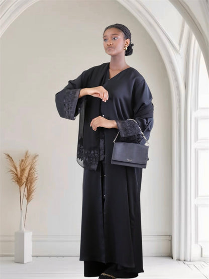 Woman wearing a black luxury embroidered abaya set with matching hijab — Ayesha's Collection USA