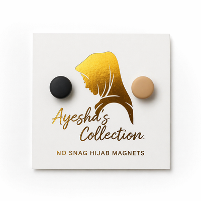 Ayesha's Collection no snag hijab magnets on a white card with gold and black designs.
