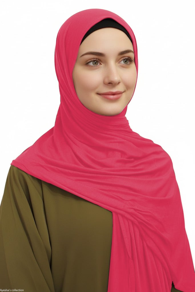 Woman wearing a bright pink hijab on a white background