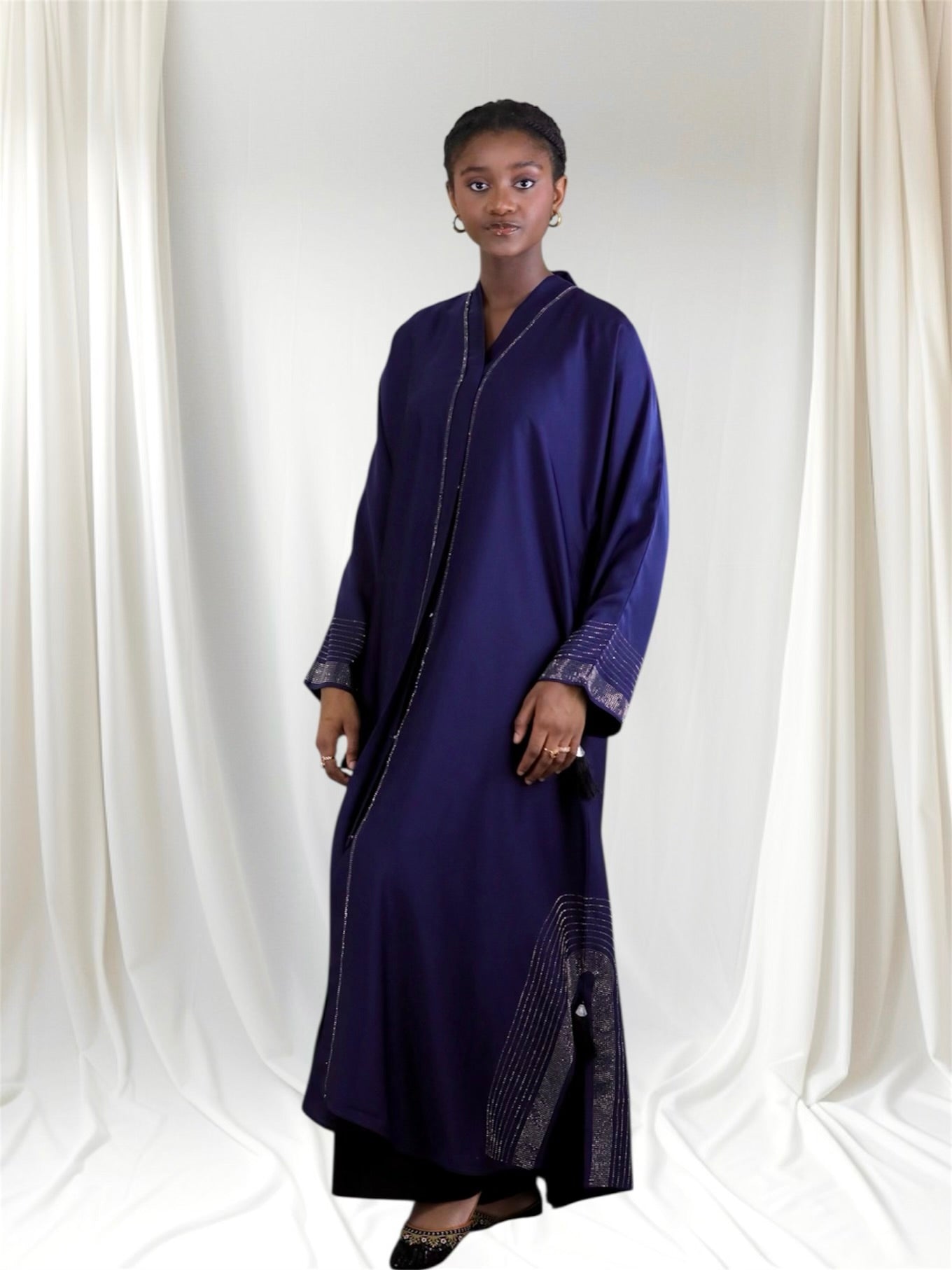 Woman wearing a long dark blue abaya