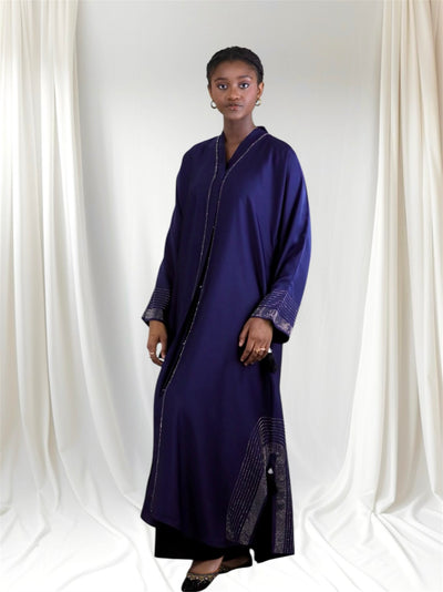Woman wearing a long dark blue abaya