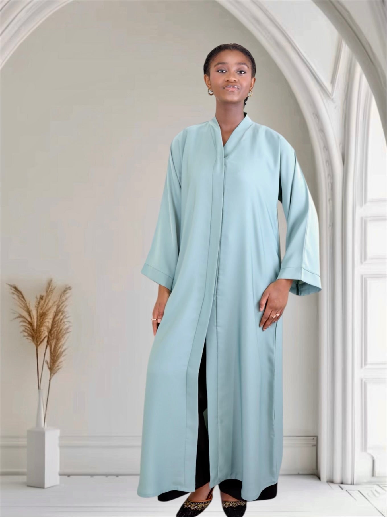 Woman wearing a light blue abaya