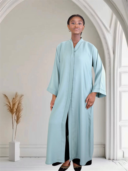 Woman wearing a light blue abaya