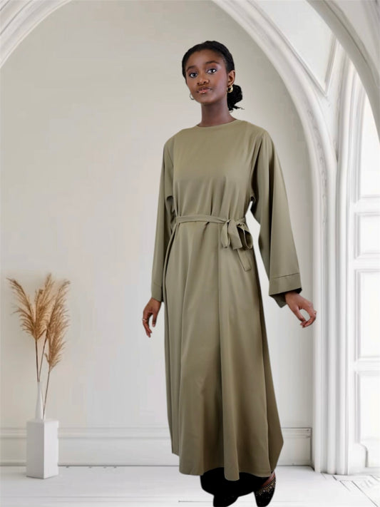 Woman long-sleeve, knee-length abaya dress with a belt