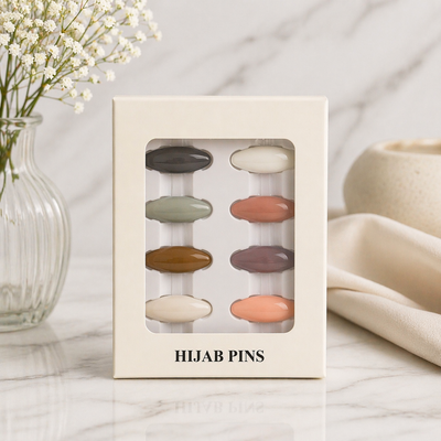 Box of hijab pins with a neutral color